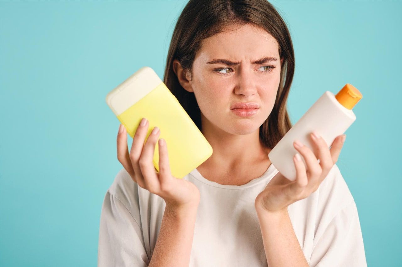 picture of frustrated person holding skincare products - skincare products not working